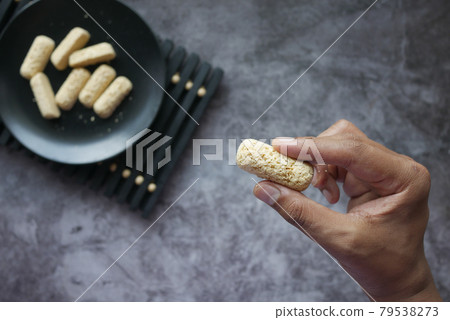 holding Tasty oats bars close up  79538273