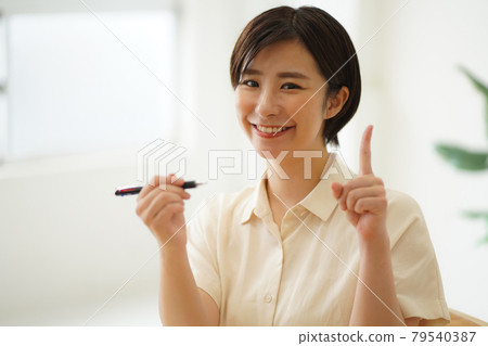 A woman practicing ballpoint pen writing A woman practicing ballpoint pen writing 79540387