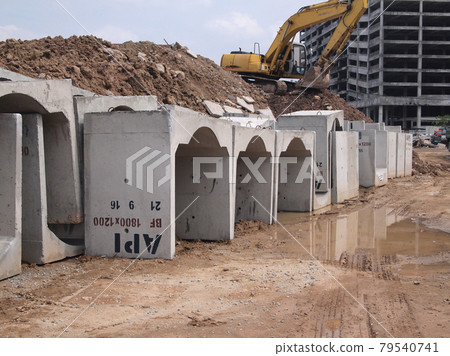 SELANGOR, MALAYSIA -DECEMBER 02, 2016: Precast concrete box culvert drain stacked at the construction site. It is used to channel storm water to the nearest monsoon drain.  79540741