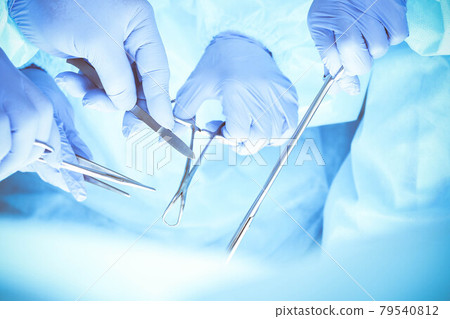 A group of surgeons is operating at the hospital, close-up of hands. Health care concept 79540812