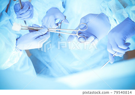 A group of surgeons is operating at the hospital, close-up of hands. Health care concept 79540814