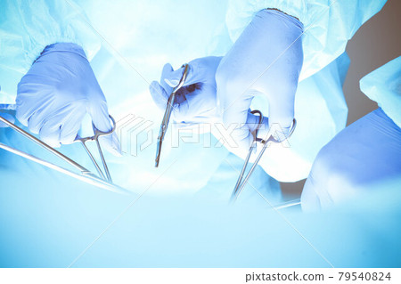 A group of surgeons is operating at the hospital, close-up of hands. Health care concept 79540824
