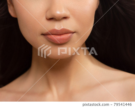 Sexual full lips. Natural gloss of lips and woman's skin. The mouth is closed. Increase in lips, cosmetology. Natural lips. Great summer mood with open eyes. fashion jewelry. Pink lip gloss 79541446