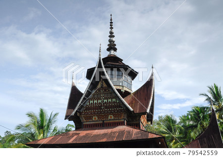 SUMATERA, INDONESIA -JUNE 10, 2014: Facade of Surau Nagari Lubuk Bauk at Tanah Datar, Sumatera Barat, Indonesia. It was a place for muslim to perform prayer and religious activity since 1901. 79542559
