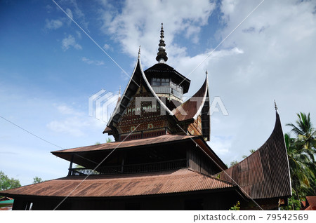 SUMATERA, INDONESIA -JUNE 10, 2014: Facade of Surau Nagari Lubuk Bauk at Tanah Datar, Sumatera Barat, Indonesia. It was a place for muslim to perform prayer and religious activity since 1901. SUMATERA, INDONESIA -JUNE 10, 2014: Facade of Surau Nagari Lubuk Bauk at Tanah Datar, Sumatera Barat, Indonesia. It was a place for muslim to perform prayer and religious activity since 1901. 79542569