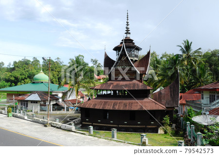 SUMATERA, INDONESIA -JUNE 10, 2014: Facade of Surau Nagari Lubuk Bauk at Tanah Datar, Sumatera Barat, Indonesia. It was a place for muslim to perform prayer and religious activity since 1901. SUMATERA, INDONESIA -JUNE 10, 2014: Facade of Surau Nagari Lubuk Bauk at Tanah Datar, Sumatera Barat, Indonesia. It was a place for muslim to perform prayer and religious activity since 1901. 79542573