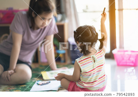 cute baby girl painting with her mother at the house cute baby girl painting with her mother at the house 79542893