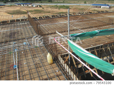 SELANGOR, MALAYSIA -MAY 13, 2016: Steel reinforcement bar at the construction site to form steel reinforced concrete slab. It use to strengthen the concrete. It is shaped follow the engineer design. SELANGOR, MALAYSIA -MAY 13, 2016: Steel reinforcement bar at the construction site to form steel reinforced concrete slab. It use to strengthen the concrete. It is shaped follow the engineer design. 79543100