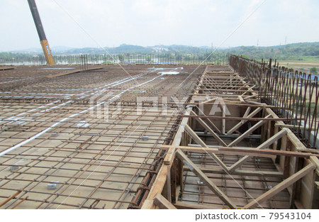 SELANGOR, MALAYSIA -MAY 13, 2016: Steel reinforcement bar at the construction site to form steel reinforced concrete slab. It use to strengthen the concrete. It is shaped follow the engineer design. SELANGOR, MALAYSIA -MAY 13, 2016: Steel reinforcement bar at the construction site to form steel reinforced concrete slab. It use to strengthen the concrete. It is shaped follow the engineer design. 79543104