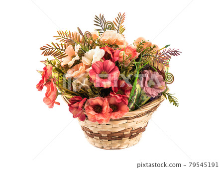 Flower arrangement of artificial flowers and grass in a basket isolated on a white background. Flower arrangement of artificial flowers and grass in a basket isolated on a white background. 79545191