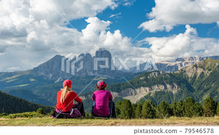Sporty Young woman friends on mountain trail Dolomites Mountains, Italy Sporty Young woman friends on mountain trail Dolomites Mountains, Italy 79546578