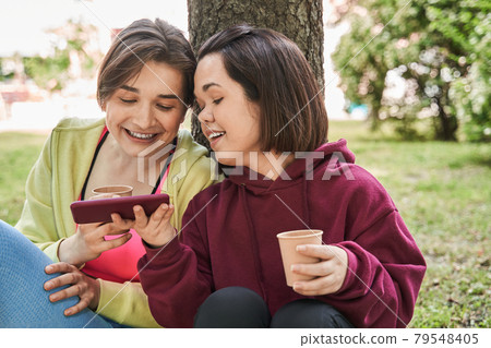 Midget woman singing songs with her best friend at the nature Midget woman singing songs with her best friend at the nature 79548405