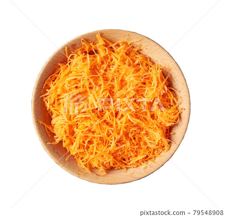 grated carrots in a wooden bowl isolated on a white background. grated carrots in a wooden bowl isolated on a white background. 79548908