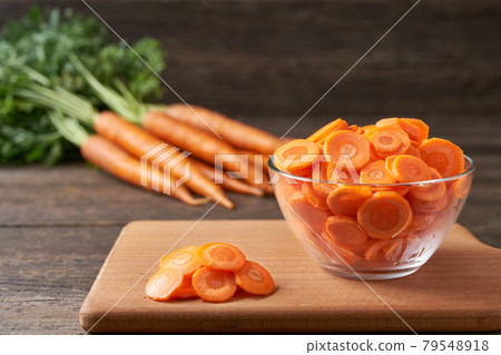 chopped carrots on a cutting board, selective focus. chopped carrots on a cutting board, selective focus. 79548918