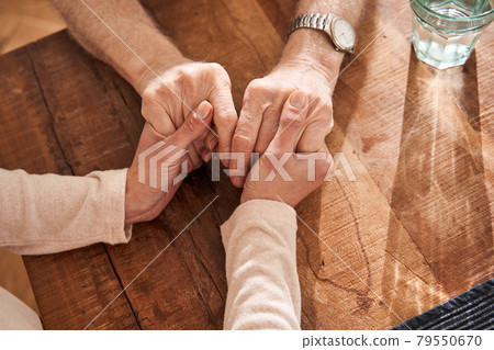 Solidarity gesture between patient and nurse while sitting Solidarity gesture between patient and nurse while sitting 79550670