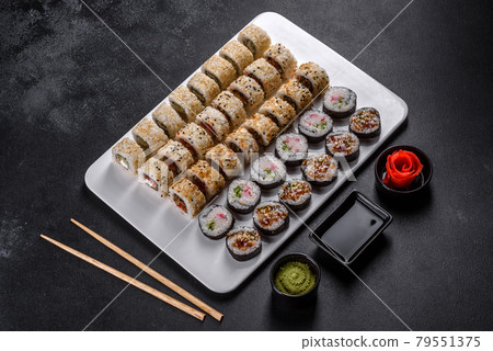 Delicious fresh rolls in various sets. Japanese food with avocado, shrimp, crab and salmon Delicious fresh rolls in various sets. Japanese food with avocado, shrimp, crab and salmon 79551375