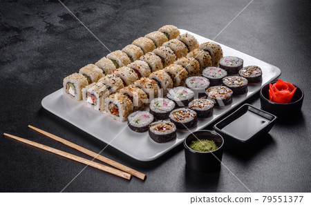 Delicious fresh rolls in various sets. Japanese food with avocado, shrimp, crab and salmon Delicious fresh rolls in various sets. Japanese food with avocado, shrimp, crab and salmon 79551377
