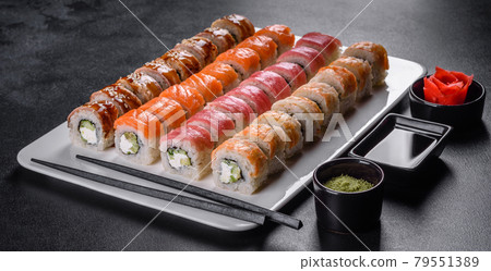 Delicious fresh rolls in various sets. Japanese food with avocado, shrimp, crab and salmon Delicious fresh rolls in various sets. Japanese food with avocado, shrimp, crab and salmon 79551389