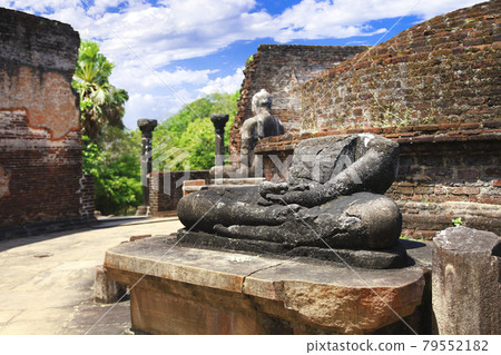 Sri Lanka travel and landmarks -  ancient city of Polonnaruwa, UNESCO World Heritage Site. Buddha statue' ruins in Vatadage temple 79552182