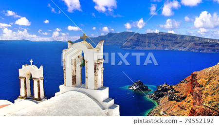 Iconic Santorini - most beautiful island in Europe. view with traditional churches in Oia village. Greece 79552192