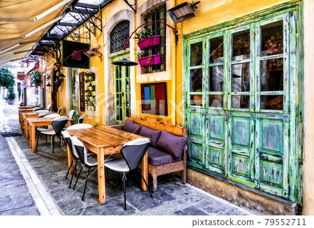 traditional tavern in narrow streets of old town Rethymno, Crete island 79552711