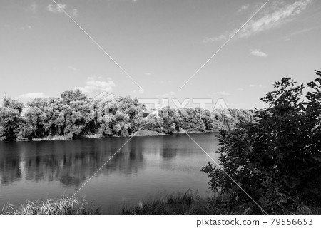 Bank of the Oka River, spaces and the church in the background 79556653