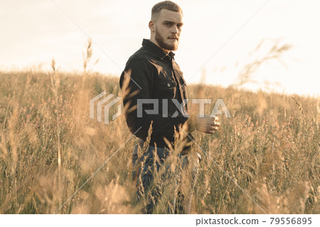 Man cowboy western car red light sunset summer 79556895