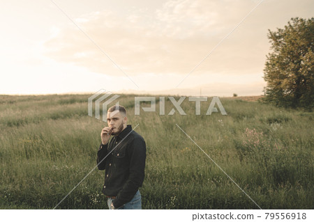 Man cowboy western car red light sunset summer 79556918