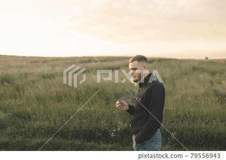 Man cowboy western car red light sunset summer 79556943