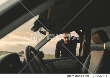 Man cowboy western car red light sunset summer 79556981