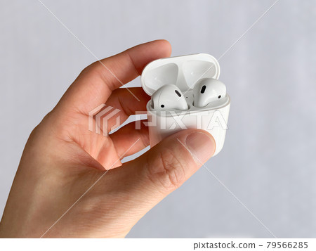 Wireless earphones in my hand 79566285