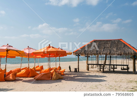 Relax beanbag seats and parasol at Cha-am beach Relax beanbag seats and parasol at Cha-am beach 79568605