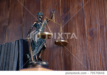 Scales of Justice, Lady Justice, law library concept, Law books in the background. 79570648