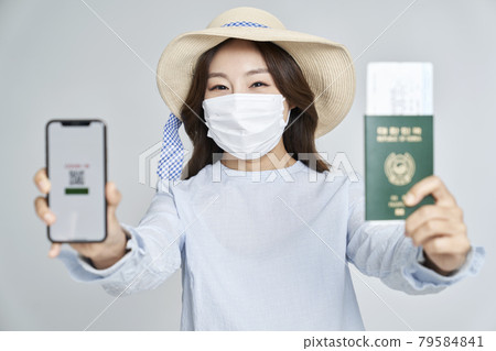 QR code, smartphone, passport, ticket, travel, overseas travel, young woman, nukki, gray background 79584841
