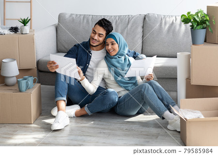 Loving arab family working on design for new apartment Loving arab family working on design for new apartment 79585984