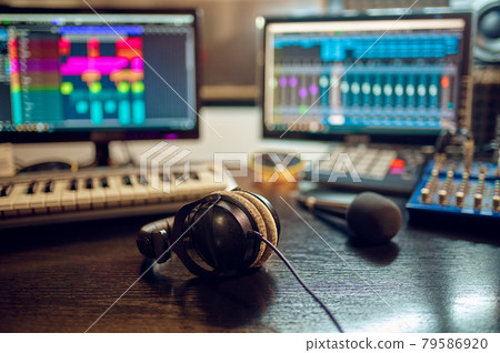 Headphones on the table, recording studio interior Headphones on the table, recording studio interior 79586920