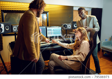 Male and female performers, recording studio 79586973