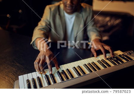 Sound engineer in headphones, recording studio Sound engineer in headphones, recording studio 79587023