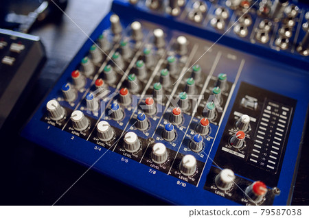 Mixing console closeup, recording studio equipment 79587038