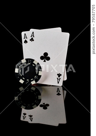 Casino chips and playing cards on dark reflective background 79587705