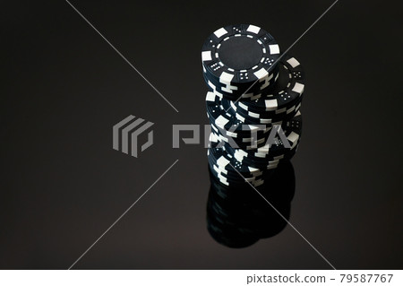 Stack of Casino gambling chips isolated on black reflective background 79587767
