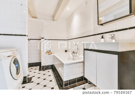 Beautiful bathroom with a bathtub and white walls 79589167