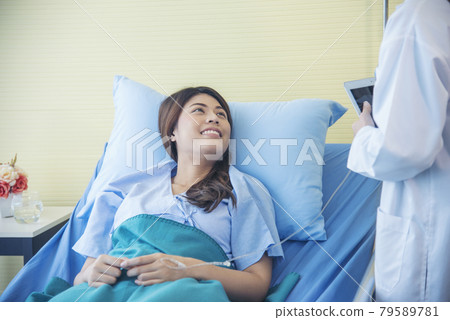 Woman doctor and patient consultation with professional specialist diagnostics at hospital medicare treatment clinic. Doctor writing prescription for medical health care therapy. 79589781