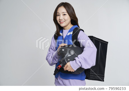 delivery, deliveryman, shipping, courier, deliveryman, helmet, young woman, nukki, gray background delivery, deliveryman, shipping, courier, deliveryman, helmet, young woman, nukki, gray background 79590233