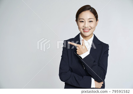 Business woman, career woman, business, suit, nude, gray background Business woman, career woman, business, suit, nude, gray background 79591582