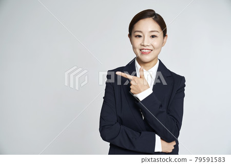 Business woman, career woman, business, suit, nude, gray background Business woman, career woman, business, suit, nude, gray background 79591583