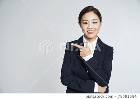 Business woman, career woman, business, suit, nude, gray background Business woman, career woman, business, suit, nude, gray background 79591584