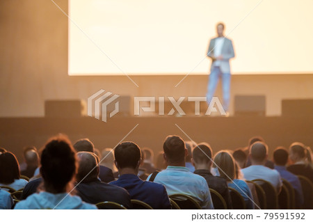 Unrecognizable people listening to speaker during business conference 79591592