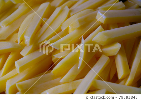 Slices of sliced potatoes close up, food. Slices of sliced potatoes close up, food. 79593843