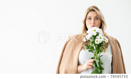 anniversary surprise overweight woman with flowers 79595733